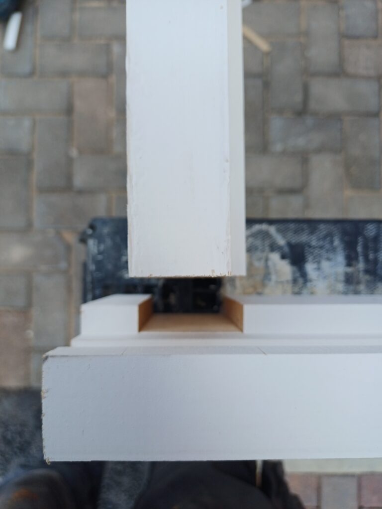 Fire door frame showing alignment and fixing condition during fault finding