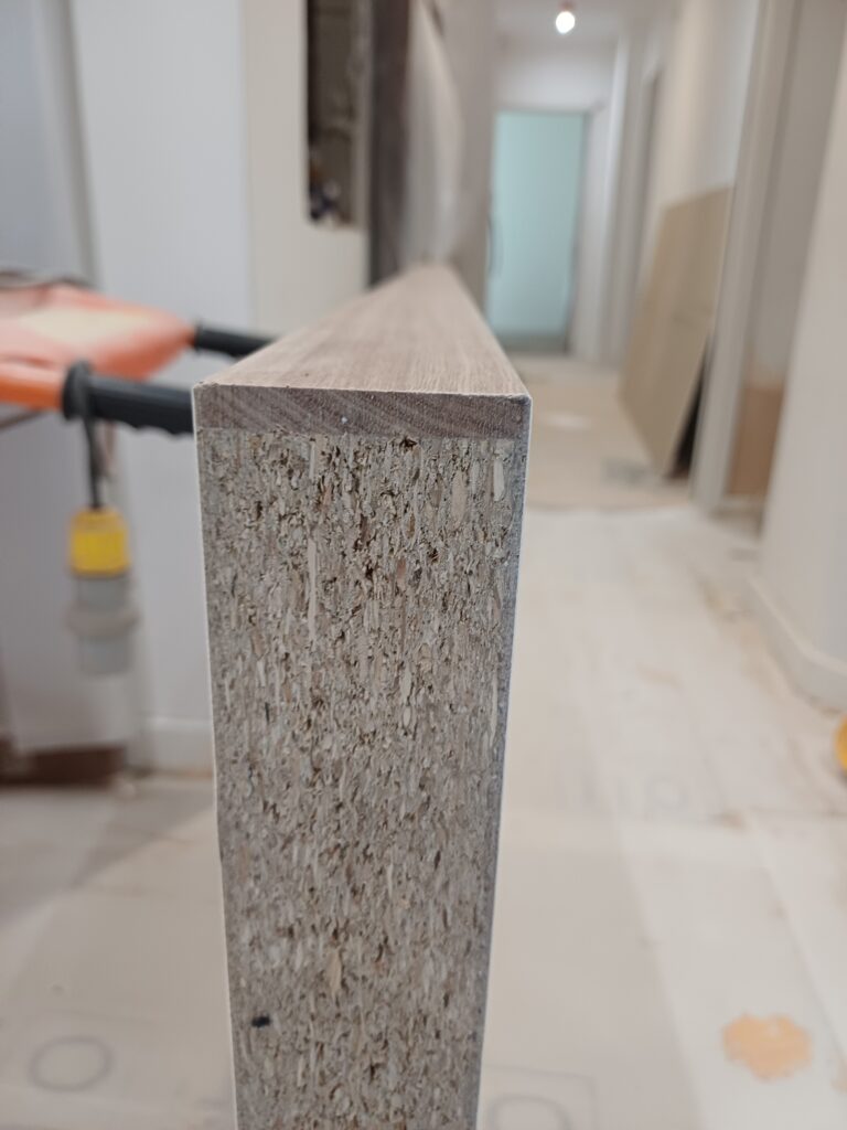 Fire door leaf being prepared before hanging with its construction and preparation being checked