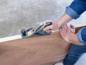 Planing the lipping edge of a fire door